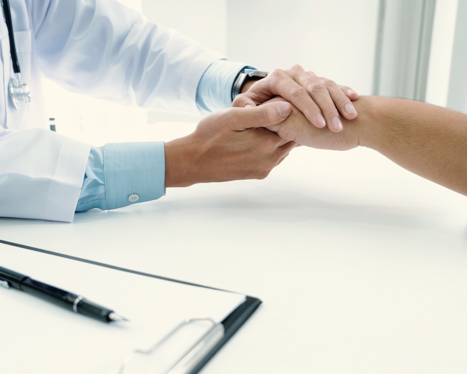 Physician talking with a patient in clinic